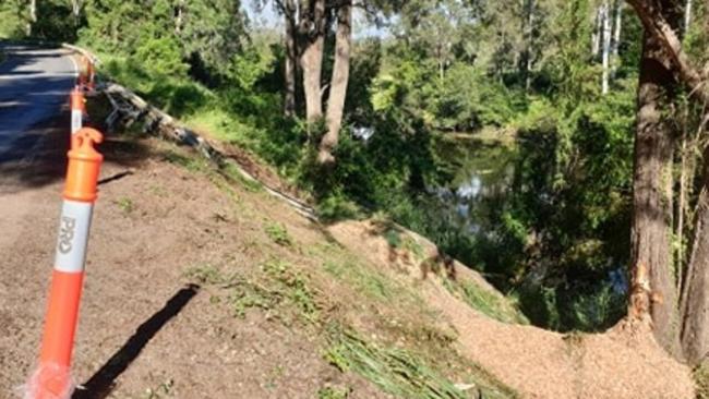 The back end of the upside down truck was partially wedged up against the two trees pictured on the right on Yabba Creek Rd at Imbil yesterday afternoon. Photo: Frances Klein