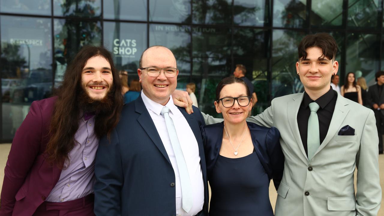 Graduate Jayke Seven, right, with brother Noah, parents Murray and Kelly at the Belmont High School year 12 graduation at GMHBA Stadium. Picture: Alison Wynd