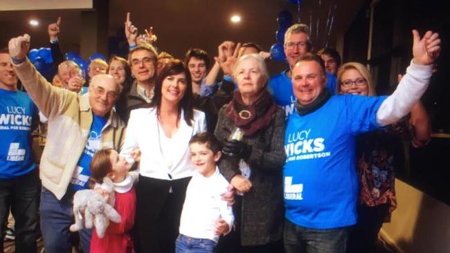 Upbeat Liberal MP Lucy Wicks with her supporters at Gosford Sailing Club.