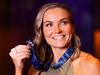 MELBOURNE, AUSTRALIA - APRIL 05: Emily Bates of the Lions poses for a photograph after winning the 2022 AFLW Best and Fairest award during the 2022 AFLW W Awards at Crown Palladium on April 05, 2022 in Melbourne, Australia. (Photo by Kelly Defina/Getty Images)