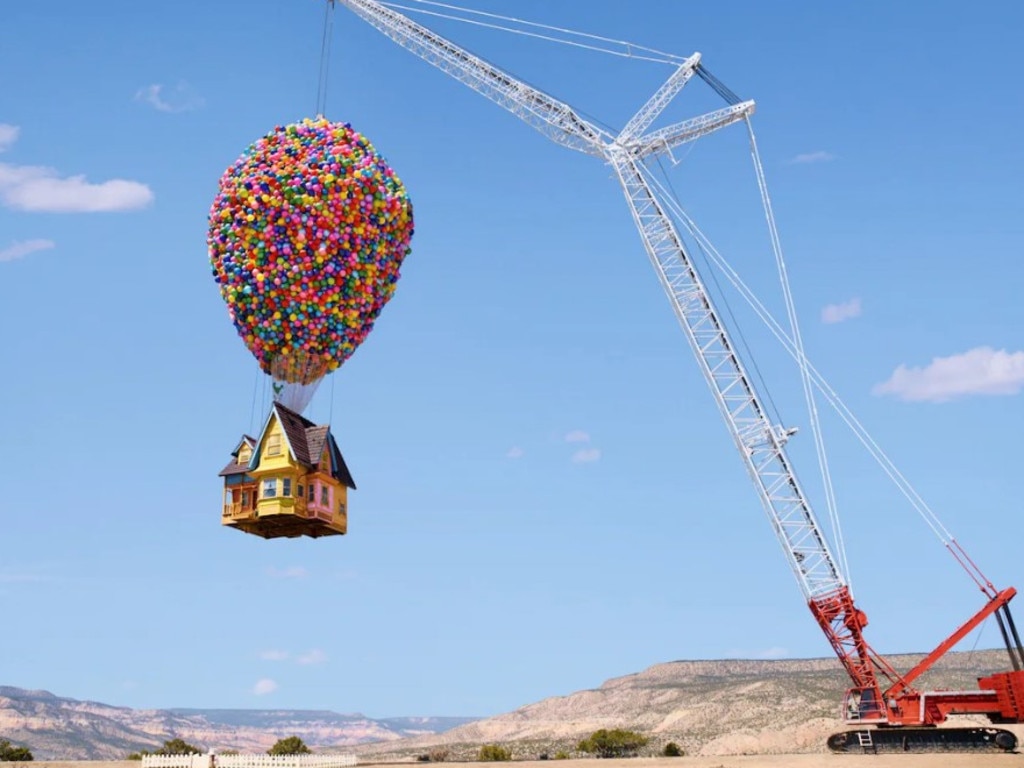 A huge crane holds the airborne house off the ground. Picture: supplied/Airbnb