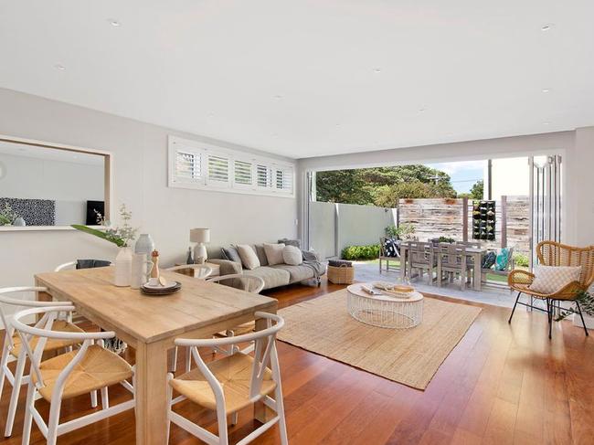 The open-plan kitchen, living and dining area flows out to the garden.