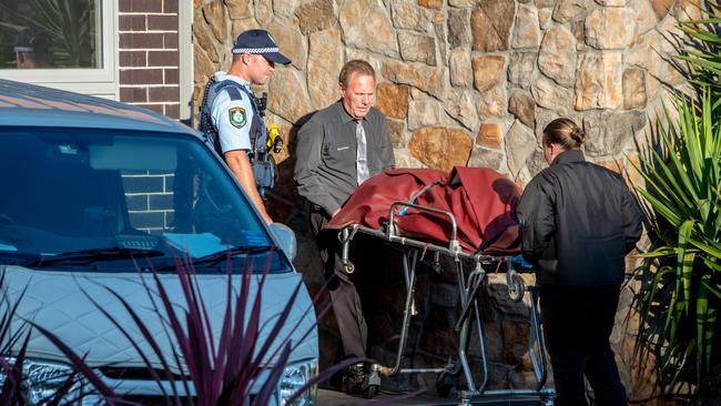 The body of the deceased man is removed from the Harrington Park home. Picture: Monique Harmer