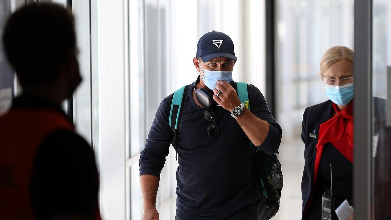 PERTH, AUSTRALIA - FEBRUARY 05: Justin Langer arrives at Perth Airport on February 05, 2022 in Perth, Australia. Langer resigned as Australian cricket head coach this morning following speculation that his position was under threat. (Photo by Paul Kane/Getty Images)