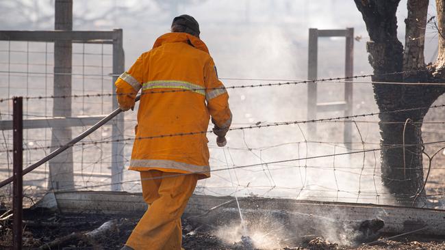 A bushfire ripped through the Livingstone area this afternoon, threatening local properties. Picture: Che Chorley