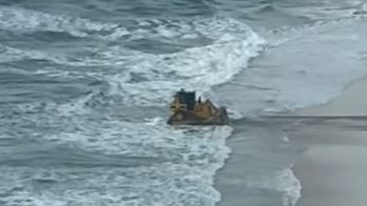 Watch: Bulldozer drives into surf at Gold Coast beach