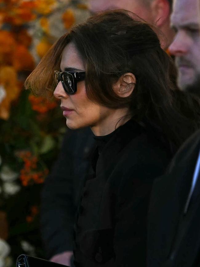 Cheryl Tweedy leaves after attending the funeral.