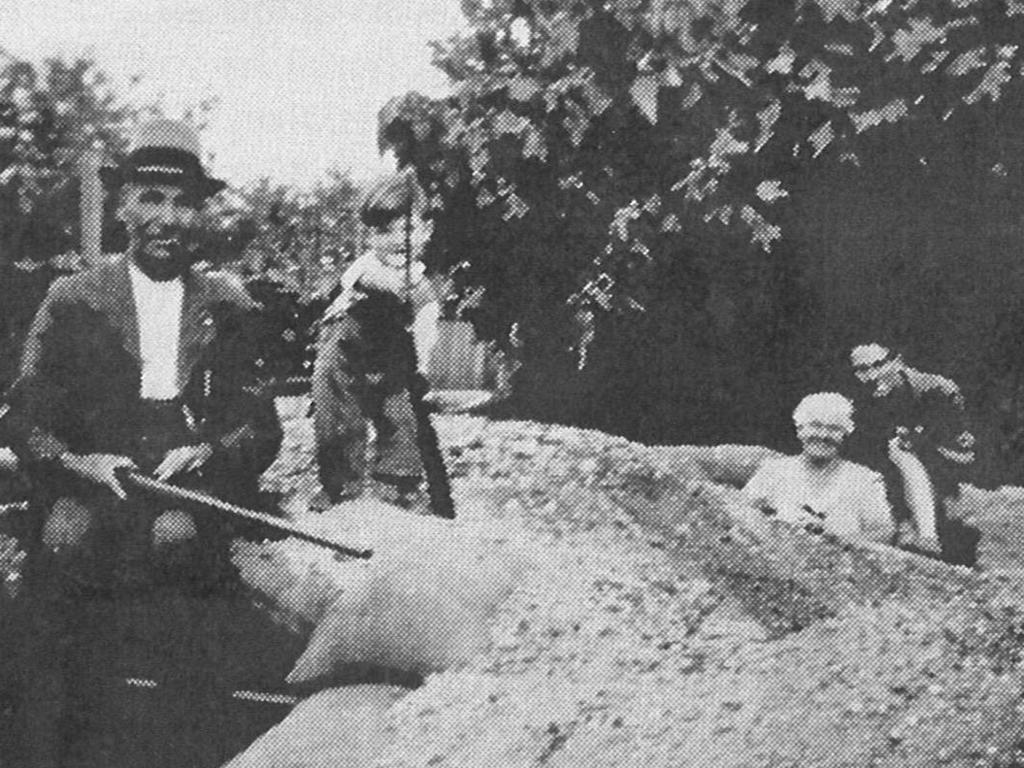 Members of the Hart family with the air-raid bunker in their Prospect backyard.