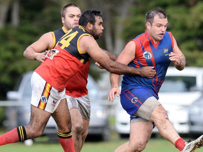 NFL: Mernda versus Fitzroy Stars at Mernda Recreation Reserve, Mernda. Northern Football League. Fitzroy Star's Malcom Dow,24 and Mernda's Kane Bannam who gets the kick away. Pictures : Angie Basdekis