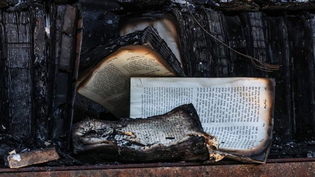 Damaged books in the library of the firebombed Adass Israel Synagogue. Picture: David Caird