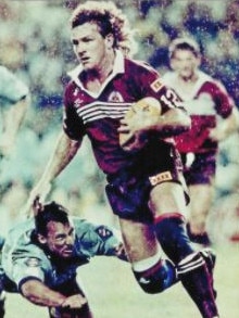 Mike McLean, who appeared at court today to support his son, evades Laurie Daley in the 1991 State of Origin series. Picture: Supplied