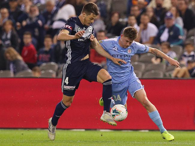 James Donachie (left) and Connor Metcalfe compete for the ball in the Melbourne derby.