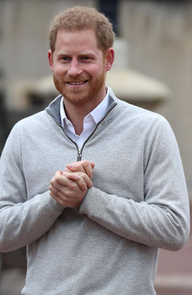 A beaming Prince Harry speaks to members of the media at Windsor Castle. Picture: Steve Parsons / Pool / AFP