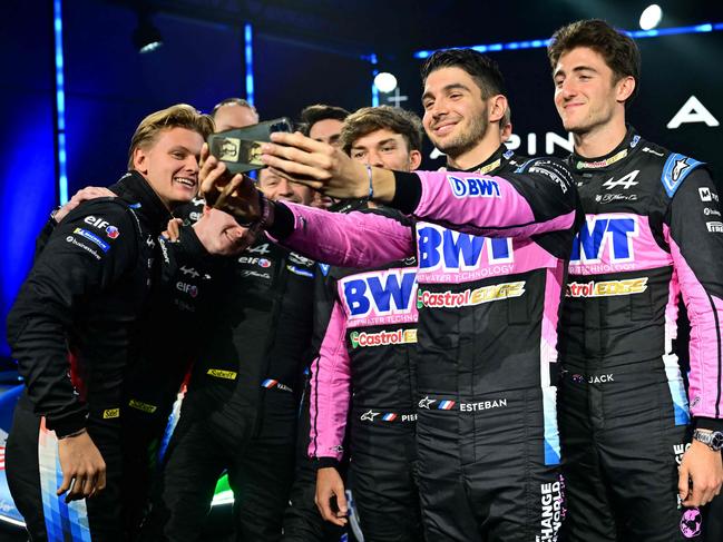 Esteban Ocon (C) takes a selfie picture with then-Alpine teammates Pierre Gasly (rear) and Jack Doohan (R). Picture: AFP