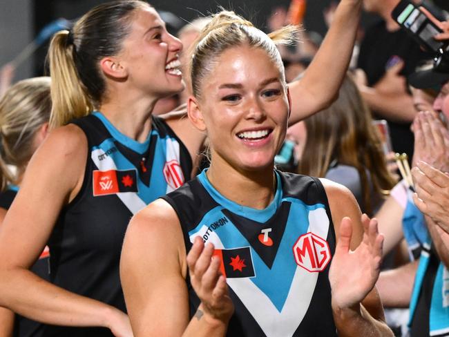 MELBOURNE, AUSTRALIA - NOVEMBER 16: Power players celebrate with fans after winning the AFLW Semi Final match between Hawthorn Hawks and Port Adelaide at Ikon Park, on November 16, 2024, in Melbourne, Australia. (Photo by Quinn Rooney/Getty Images)