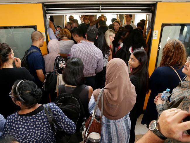 People were packed in like sardines on the trains. Picture: Jonathan Ng