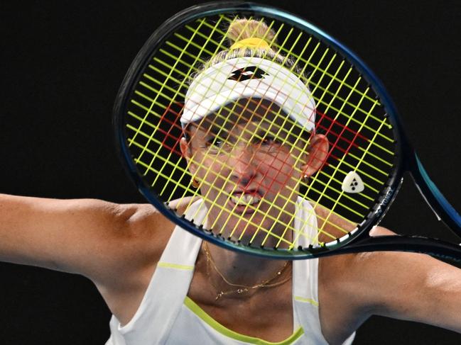 TOPSHOT - Australia's Storm Hunter looks on as she hits a return against Germany's Laura Siegemund during their women's singles match on day four of the Australian Open tennis tournament in Melbourne on January 17, 2024. (Photo by WILLIAM WEST / AFP) / -- IMAGE RESTRICTED TO EDITORIAL USE - STRICTLY NO COMMERCIAL USE --