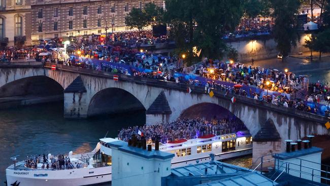 Athletes of France in a floating parade on the river Seine during the 2024 Olympic Games opening ceremony. Picture: Peter Cziborra / AFP