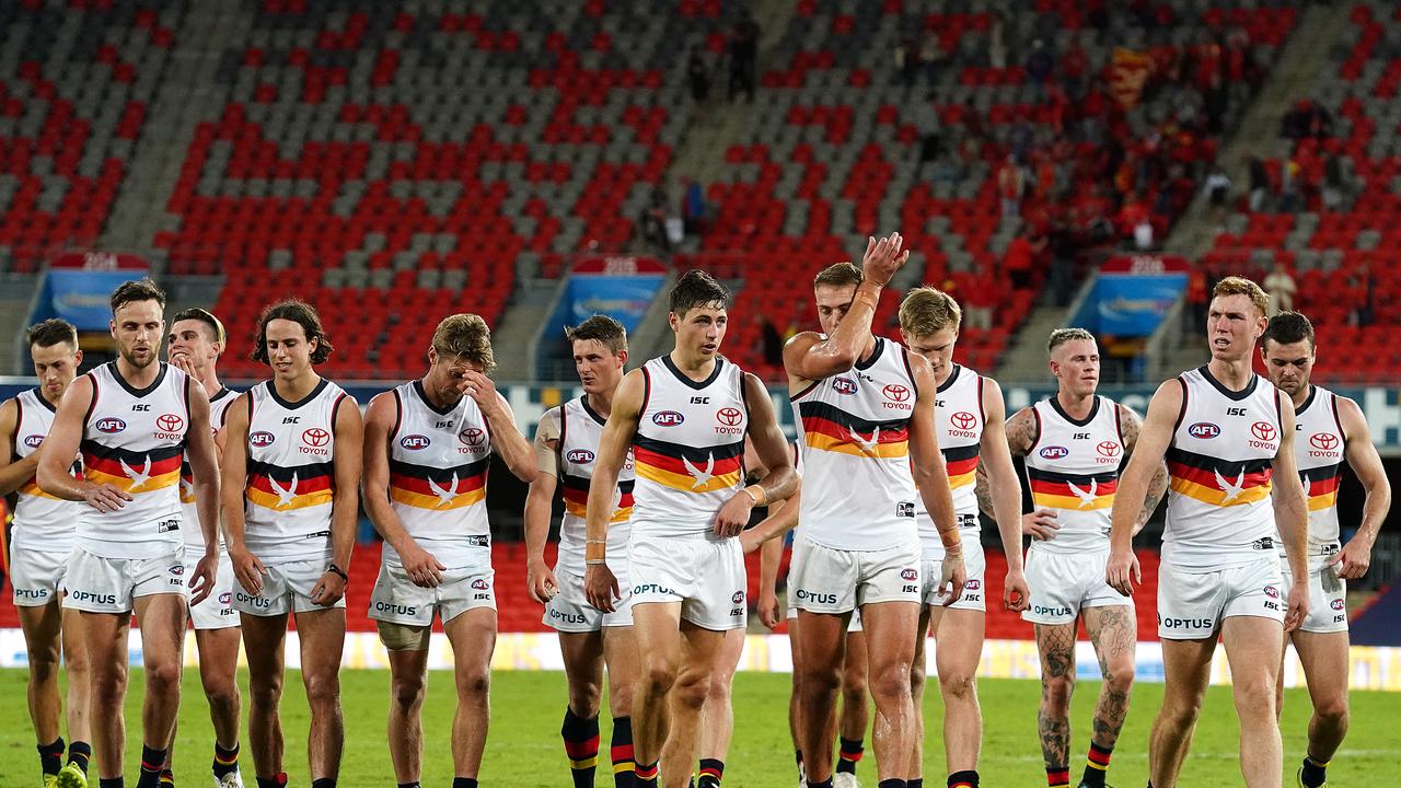 Crows players leave the field following the Round 3 AFL match between the Gold Coast Suns and the Adelaide Crows at Metricon Stadium on the Gold Coast, Sunday, June 21, 2020. (AAP Image/Dave Hunt)