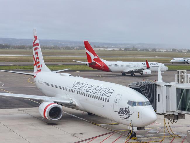 ADELAIDE, AUSTRALIA - NewsWire Photos SEPTEMBER 22, 2021: Virgin, Qantas and Cobham aircraft at Adelaide Airport. Picture: NCA NewsWire /Brenton Edwards