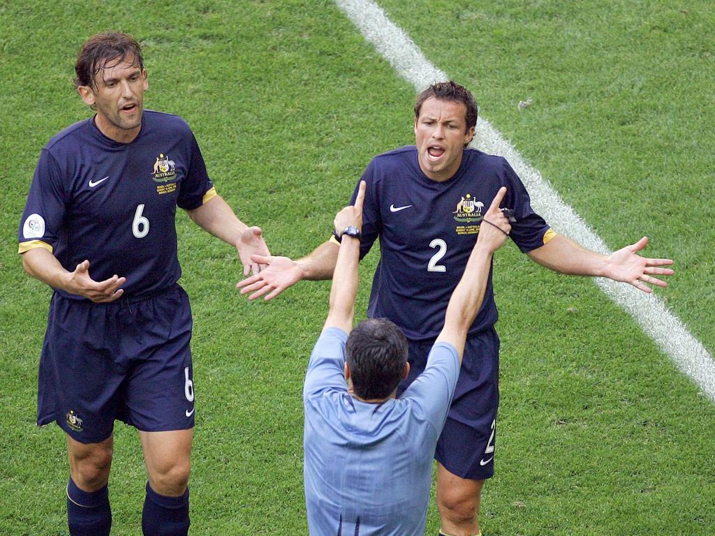 Australia's Tony Popovic, left, and Lucas Neill during Australia’s World Cup clash with Brazil in 2006. Popovic is now the Socceroos coach. Picture: AP