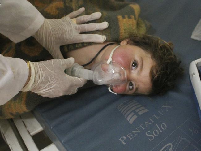 A Syrian doctor treats a child following a suspected chemical attack in the town of Khan Sheikhun, northern Idlib province, Syria. Picture: AP