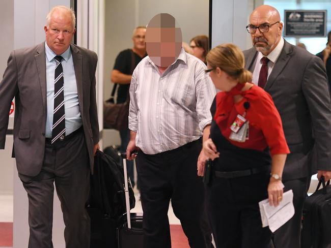 A man (centre) was arrested in 2017 and charged with toddler Cheryl Grimmer’s murder. The case was dismissed on a legal technicality. Picture: AAP Image/Paul Miller