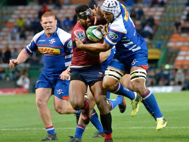 Reds centre Samu Kerevi fights off Stormers forward Nizaam Carr in their match at the Newlands Stadium. Picture: AFP