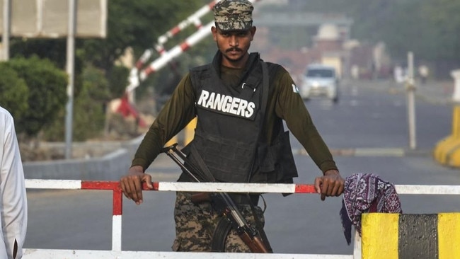 A Pakistani paramilitary soldier stands guard at a checkpoint in Wagah, a joint border crossing point on the Pakistan and India border. Picture: AP
