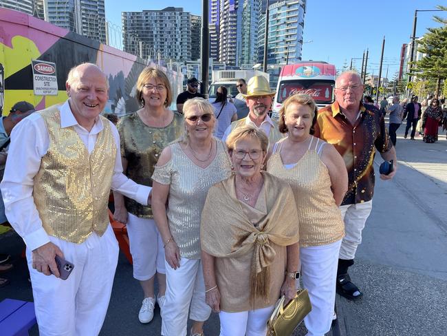 David, Christine, Donna, Geoff, Maz, Julie and Peter all dressed for the occasion in matching gold outfits, travelling to Melbourne from Benalla to celebrate New Year's Eve watching the fireworks in Docklands, Melbourne. Picture: Athos Sirianos