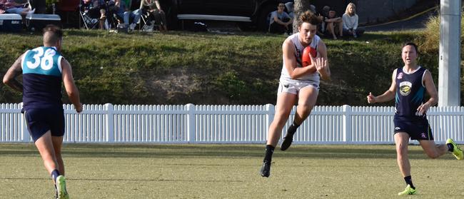 Playing for the Park Ridge Pirates, Nathan Colenso takes a mark.