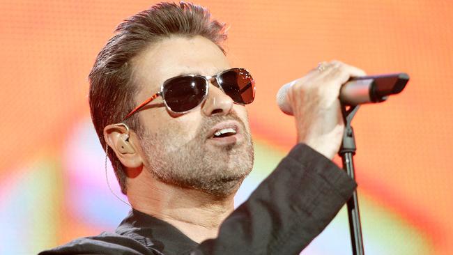 LONDON - JULY 02:  Singer George Michael performs on stage at "Live 8 London" in Hyde Park on July 2, 2005 in London, England.  The free concert is one of ten simultaneous international gigs including Philadelphia, Berlin, Rome, Paris, Barrie, Tokyo, Cornwall, Moscow and Johannesburg. The concerts precede the G8 summit (July 6-8) to raising awareness for MAKEpovertyHISTORY.  (Photo by MJ Kim/Getty Images)