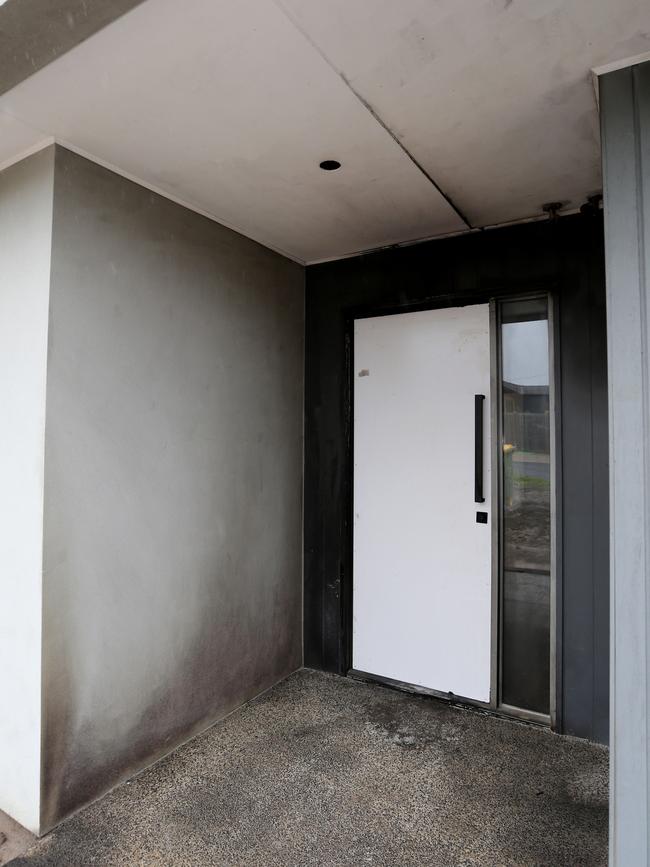 The home’s scorched doorway. Picture: Mike Dugdale