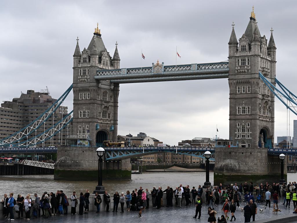 The queue on the South Bank of the River Thames, alongside Tower Bridge, as people wait in line to pay their respects to the late Queen. Picture: AFP.