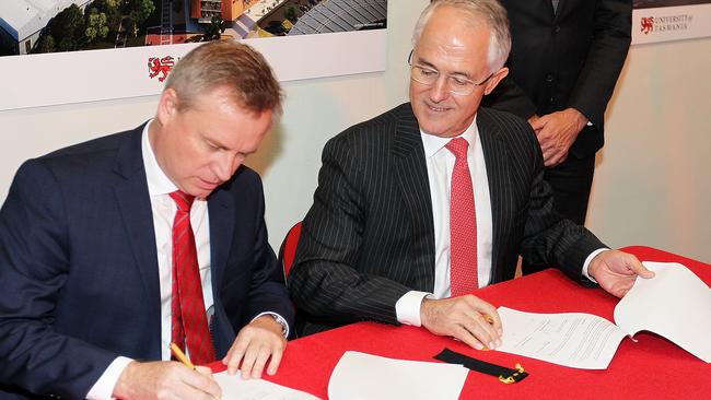 Tasmania’s Acting Premier Jeremy Rockliff, left, and Prime Minister Malcolm Turnbull sign the MoU at the University of Tasmania in Launceston. Picture: BRUCE MOUNSTER