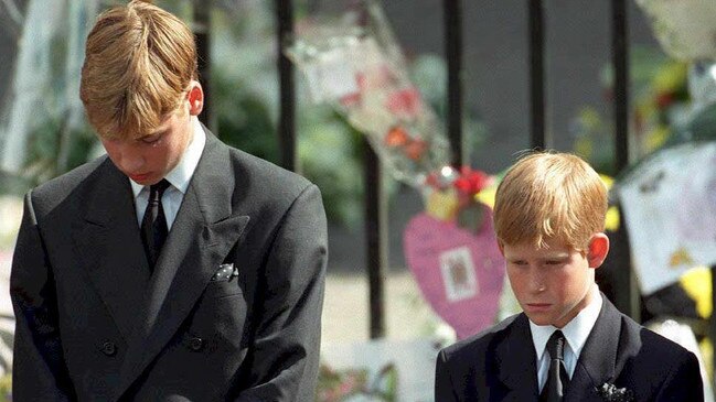 Prince William and Prince Harry bow their heads as their mother's coffin is taken out of Westminster Abbey. Picture: AFP Photo/Pool/Adam Butler