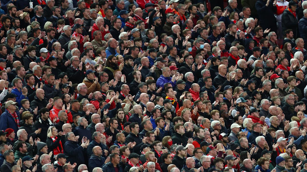 LIVERPOOL, ENGLAND - APRIL 19: Liverpool fans applaud during the Premier League match between Liverpool and Manchester United at Anfield on April 19, 2022 in Liverpool, England. (Photo by Clive Brunskill/Getty Images)