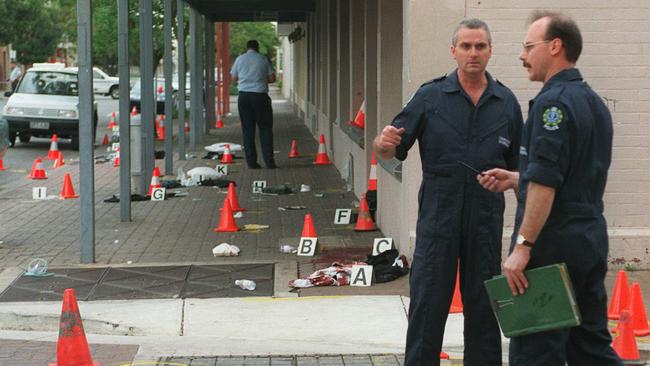 Police at the scene of the Rebels shooting in 1999, in the CBD.