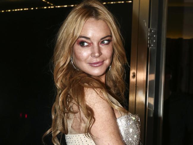 Lohan poses outside her new Athens club. Picture: AP Photo/Yorgos Karahalis