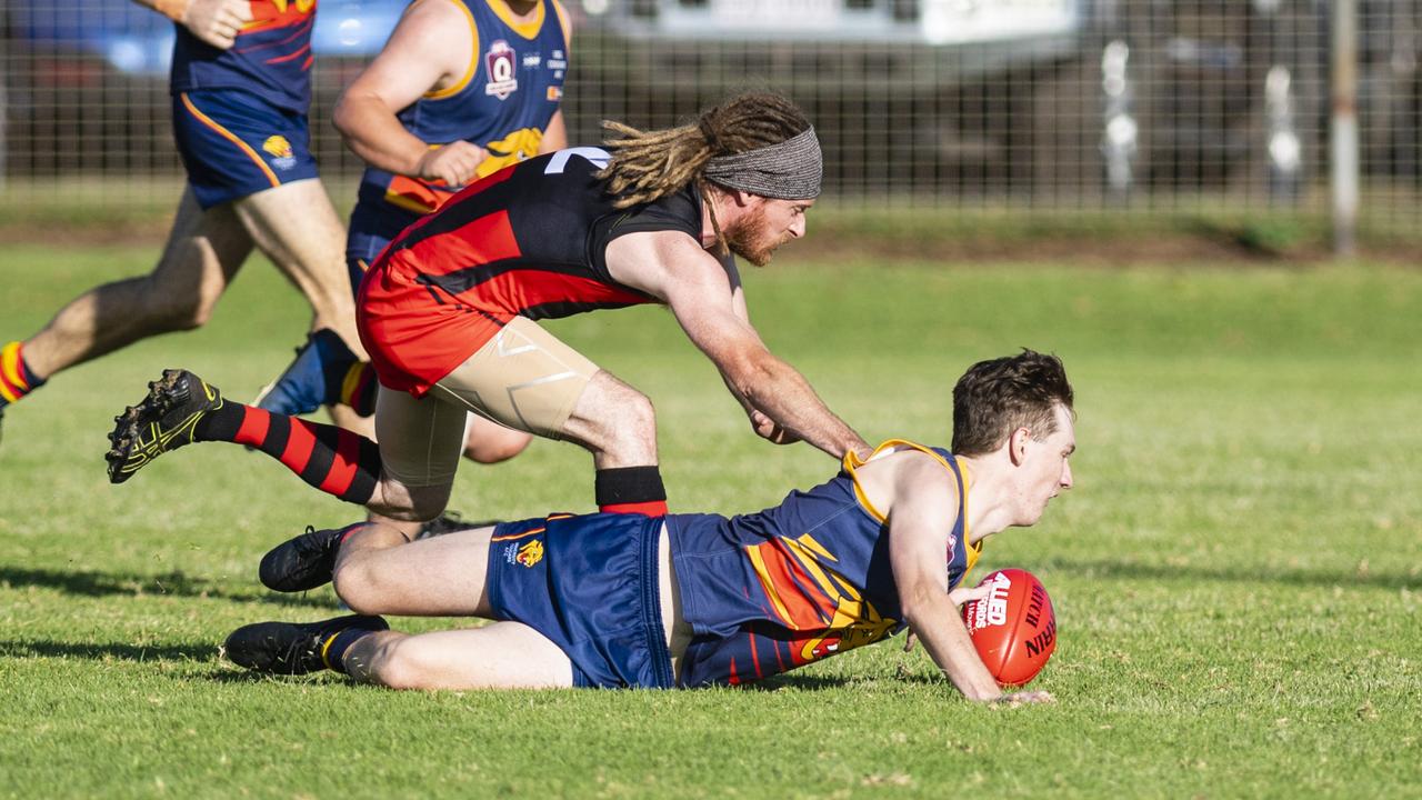 Bradley Harrison competes for possession for South Toowoomba Bombers against Jared Jeit of University Cougars. Picture: Kevin Farmer