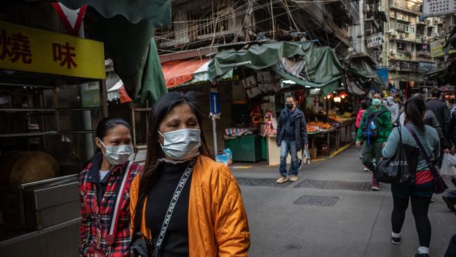 Residents wearing face masks shop at a market in Macau on January 28, 2020. Photo: Anthony Kwan/Getty Images