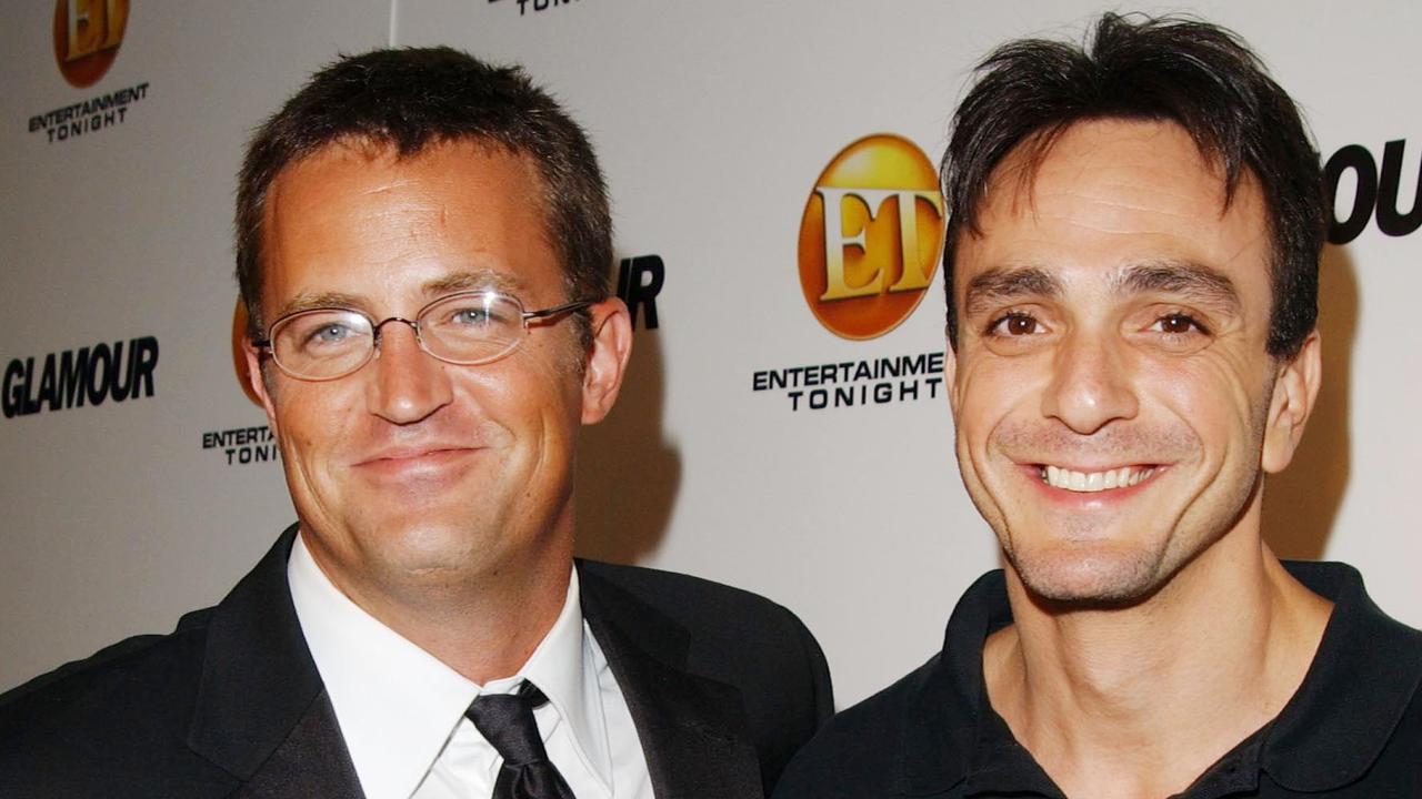 Stars far and wide, including actor Hank Azaria pictured here with Perry, have paid tribute to him. Picture: Jon Kopaloff/Getty Images