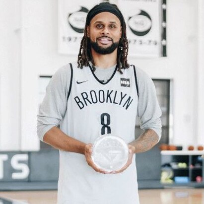 Patty Mills with the special award.