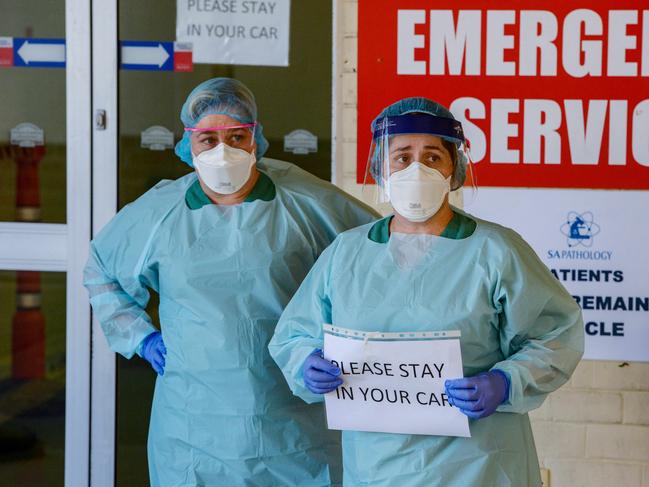 Nurses at the new drive-through coronavirus testing station at the Repat Hospital. Picture: AAP / Brenton Edwards