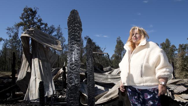 Katherine Reeves looks at her house destroyed by fire in Millmerran Downs. Wednesday, 15th Jul, 2020.