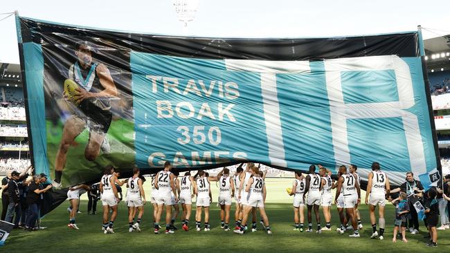 Port Adelaide celebrates milestone man Travis Boak. Picture: Darrian Traynor/Getty Images