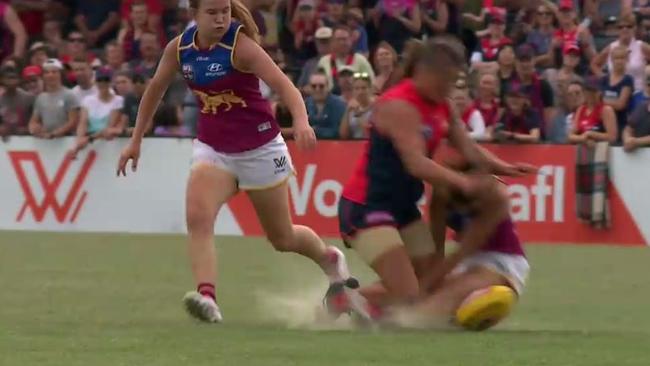 Jamie Stanton is collected by Richelle Cranston during the AFLW game between Melbourne and the Brisbane Lions.