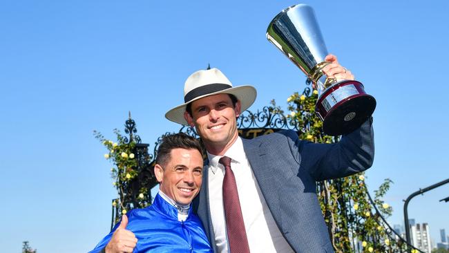 Dean Holland with James Cummings after riding In Secret to win the Newmarket Handicap. Picture: Vince Caligiuri/Getty Images