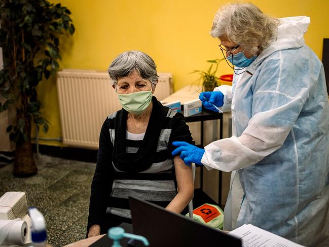 An elderly woman receives the second dose of the Pfizer-BioNTech COVID-19 vaccine shot against the coronavirus disease at a care home in Sofia this week. Picture: AFP