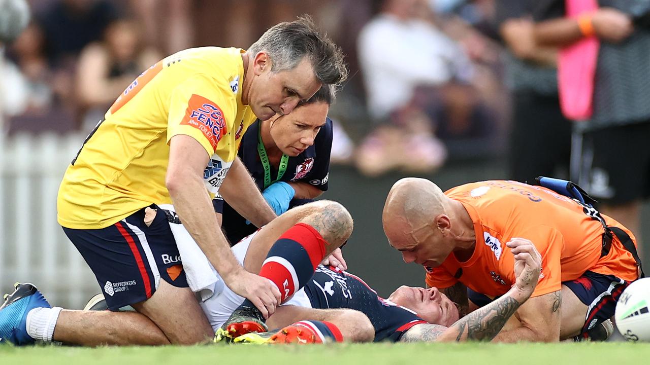 Jake Friend is attended to by Roosters staff following a head knock. (Photo by Cameron Spencer/Getty Images)